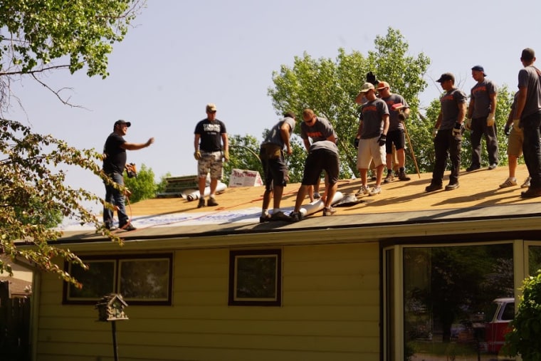 Firefighters surprise woman who brought them treats for 13 years with new roof