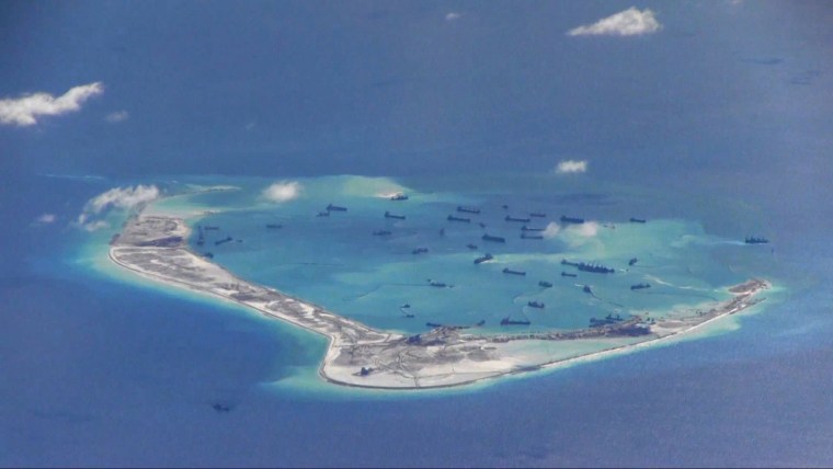 Image: File still image from United States Navy video purportedly shows Chinese dredging vessels in the waters around Mischief Reef