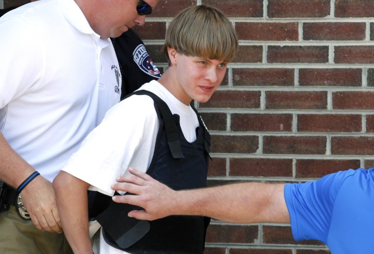 Image: Police lead suspected shooter Dylann Roof into the courthouse in Shelby, North Carolina