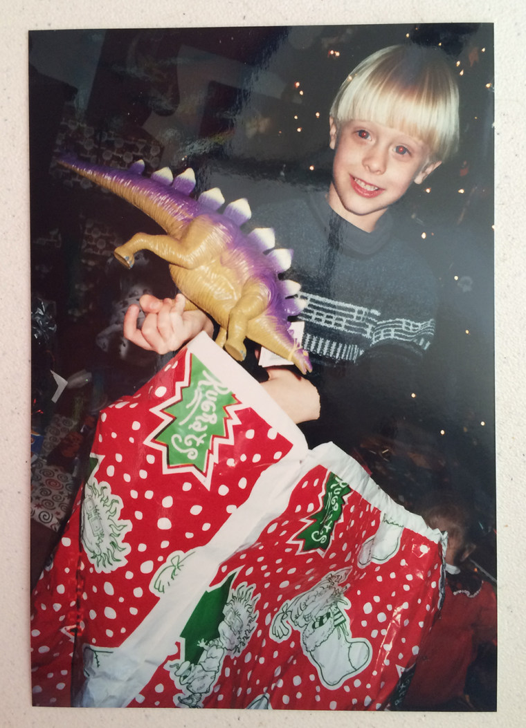 Dylann Roof opens a Christmas present in a family photo.