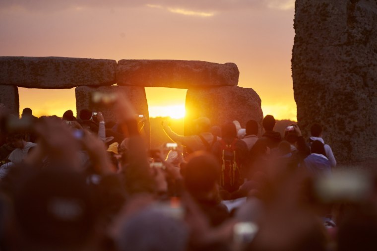 Image: Revelers celebrate the pagan festival of Summer Solstice at Stonehenge.