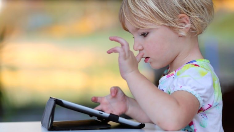 Child playing with a tablet
