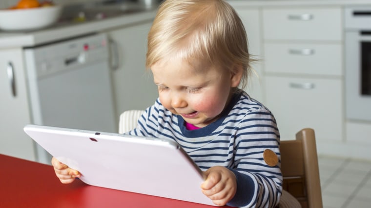 Toddler using a tablet.