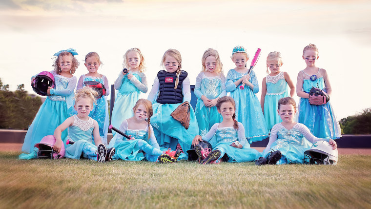 Tee ball team takes team photo in Elsa dresses