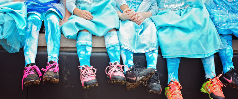 Tee ball team takes team photo in Elsa dresses