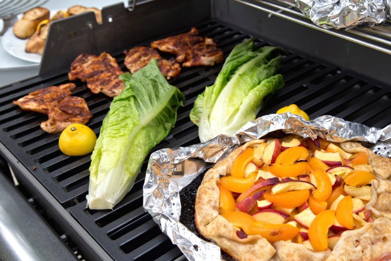 Grill a whole meal: BBQ Chicken Thighs; Grilled Fruit Tart; Roasted Root Vegetable Packets; Grilled Caesar Salad
