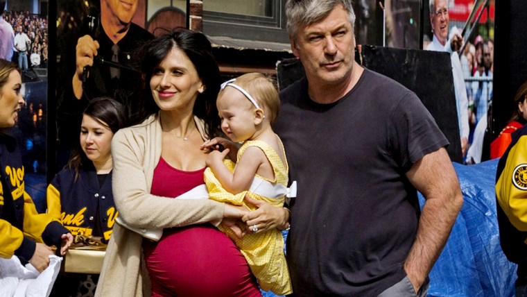 Image: Alec and Hilaria Baldwin arrive with their daughter Carmen at Ed Sullivan Theater in Manhattan as David Letterman prepares for the taping of tonight's final edition of "The Late Show" in New York