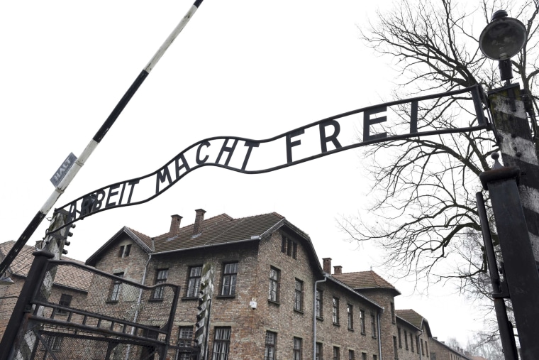 Image: File photo of the sign \"Arbeit macht frei\" at the main gate of the former German Nazi concentration and extermination camp Auschwitz in Oswiecim