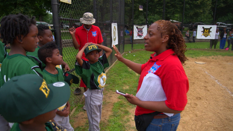 Officer Angela  Wormley is a volunteer coach for the Englewood Police Youth Baseball League.