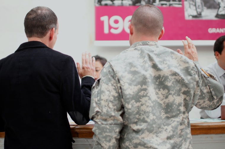 Image: Todd Saunders and U.S. Army Captain Michael Potoczniak take oath