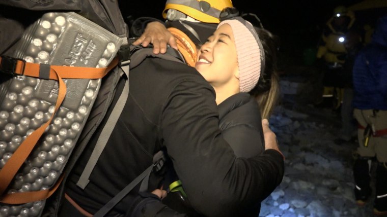 Eve Girawong, the Madison group’s expedition doctor, hugs a climber before they leave to climb Mt. Everest. Girawong died from injuries she received during the avalanche.