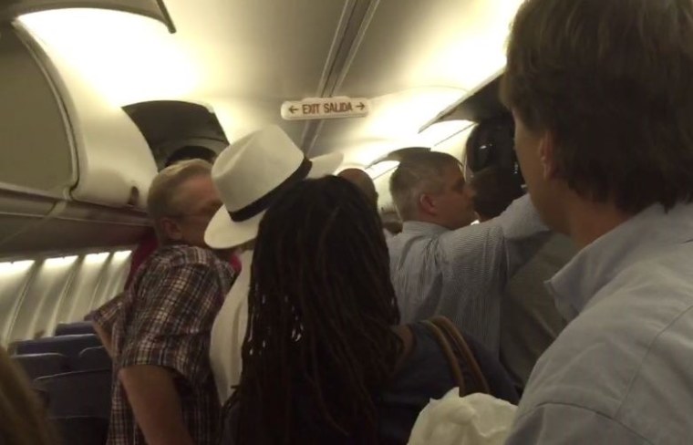 Passengers evacuate Southwest flight 397 in Houston on June 26.