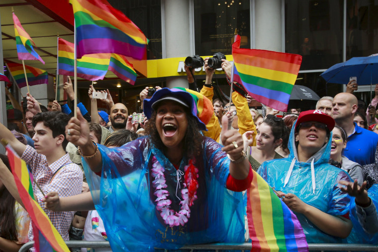Image: Spectators cheer marchers during the annual Gay Pride parade in New York