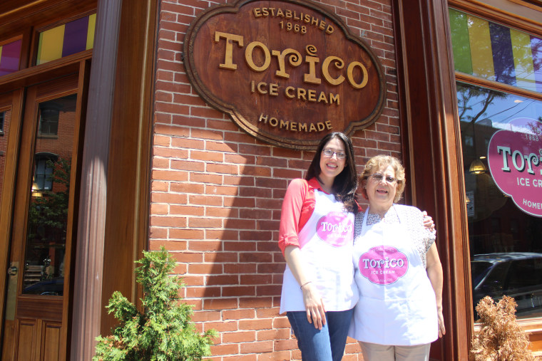 Pura Berrios and her daughter Christine in front of their ice cream store, “Torico,” a business created when Pura missed the taste of tropical fruits from her native Puerto Rico and wanted to recreate them in the U.S.