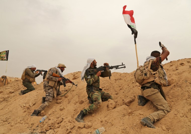 Image: Badr Organization fighters clash with ISIS near Fallujah, Iraq, on June 1