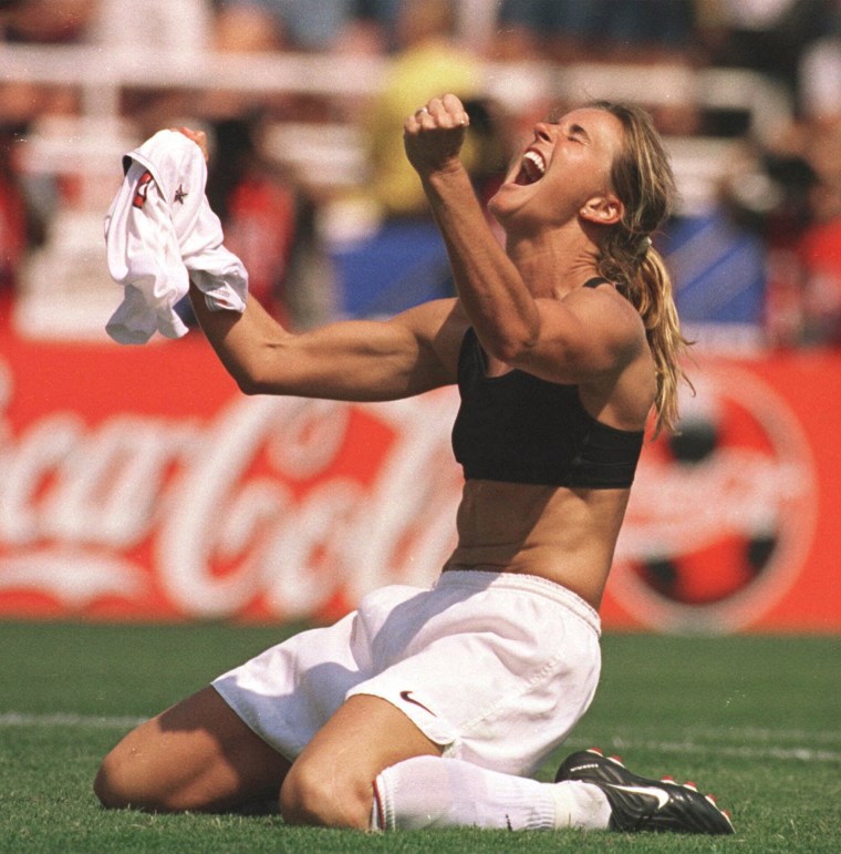 Image: United States' Brandi Chastain celebrates after kicking the game-winning overtime penalty shootout goal against China