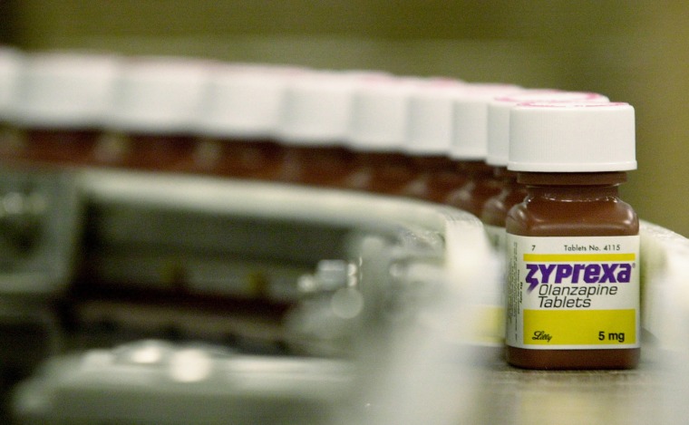 Bottles filled with the anti-psychotic drug Zyprexa sit on a packaging line at a Eli Lilly &amp; Co. factory in Indianapolis.