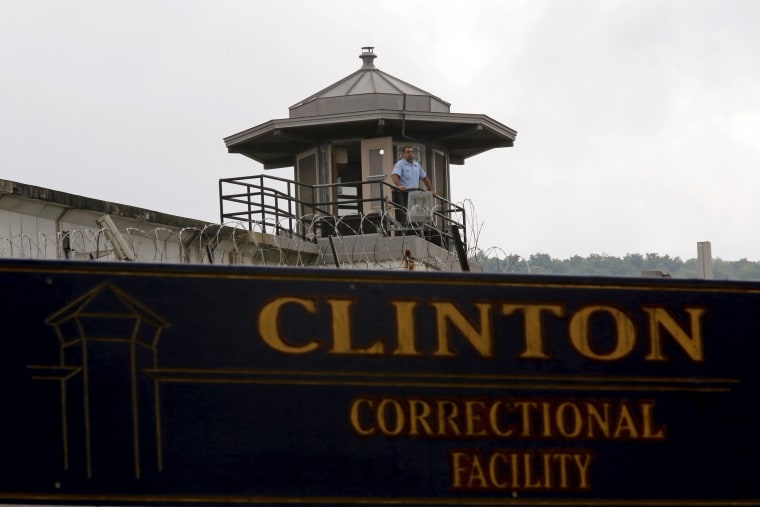 Image: A guard stands in a tower at the Clinton Correctional Facility in Dannemora