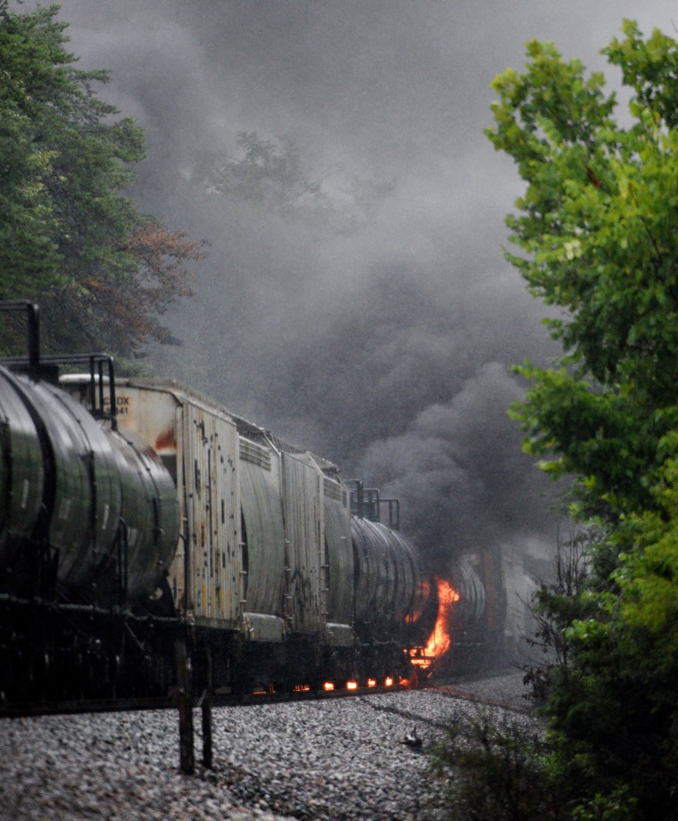 Image: Smoke rises from a CSX train following the derailment of a train car