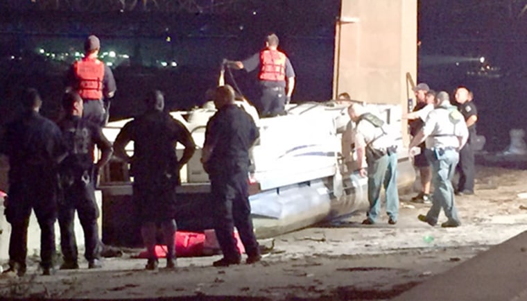 Image: Police say at least two people are dead after a boat capsized on the Ohio River near Louisville, Ky. on Saturday.