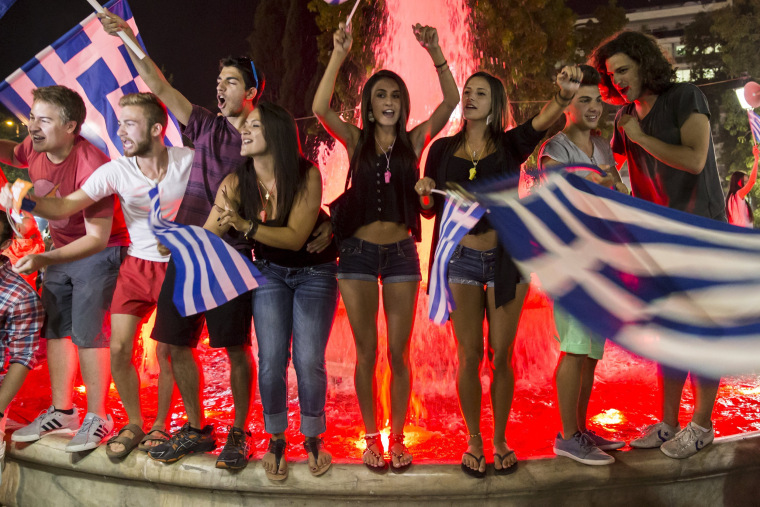 Image: "No" supporters celebrate referendum results on a street in central in Athens
