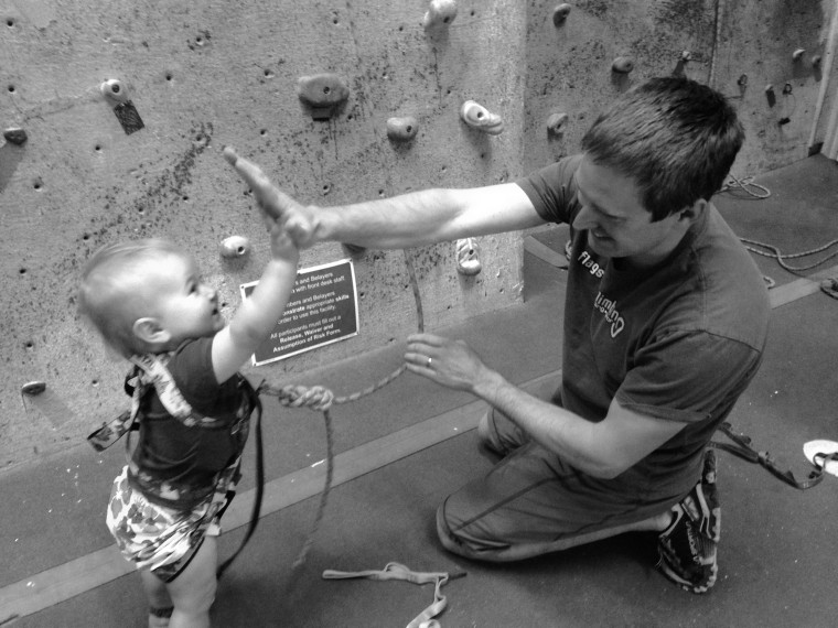 Zak Farmer high fives his 20-month-old rock climbing daughter, Ellie