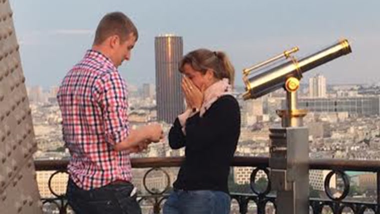 unnamed couple get engaged on Eiffel Tower.