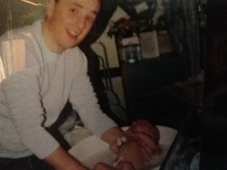 Mark Williams with his newborn son in 2004.