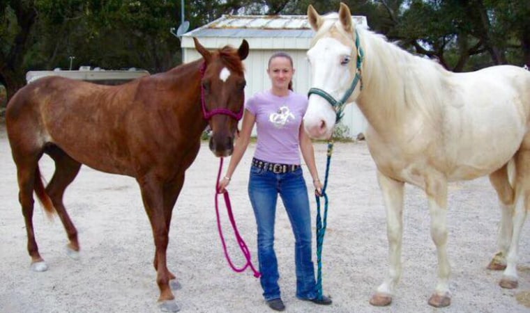 Lynda Brown, 30, with two of her horses.