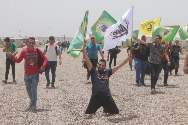 Image: New volunteers join the Babylonian Brigades' military training camp near Baghdad.