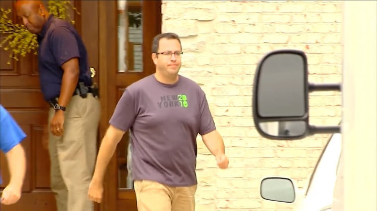 Jared Fogle is seen outside of his home as the FBI searched the house.
