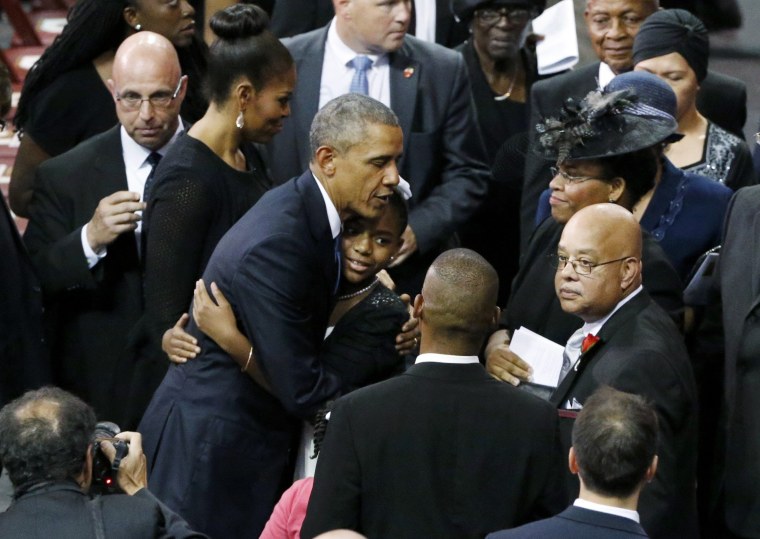Image: U.S. President and first lady Obama greet Pinckney family members during funeral services in Charleston