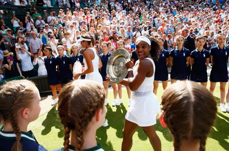Image: Serena Williams leaves court with the Venus Rosewater Dish after her victory
