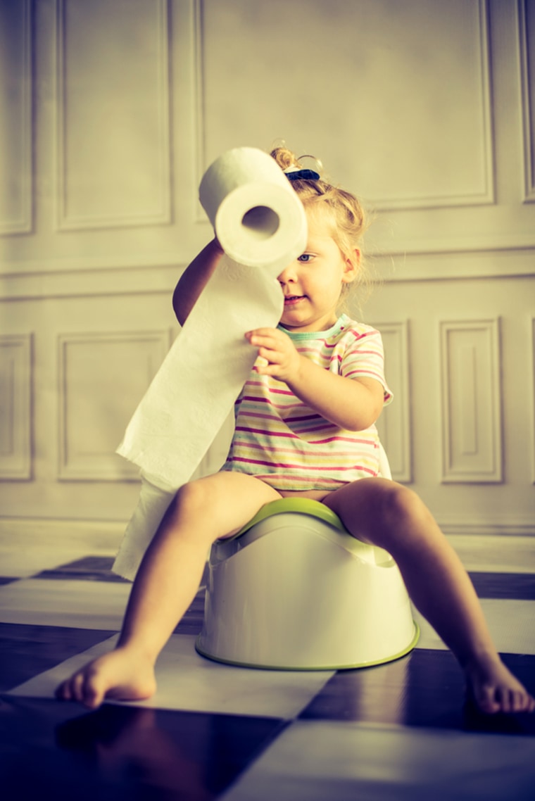 Child sitting on potty.