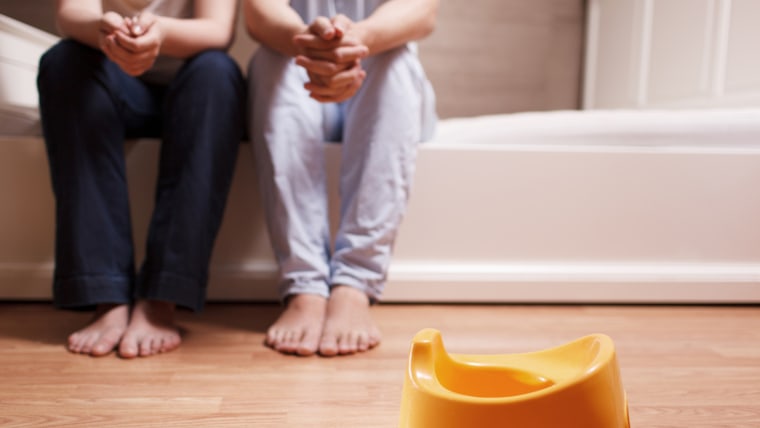 Parents sitting near potty.