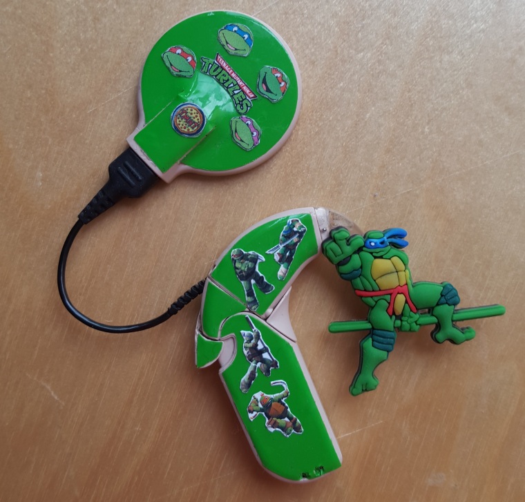 This cochlear implant by Lugs features images of the Teenage Mutant Ninja Turtles.