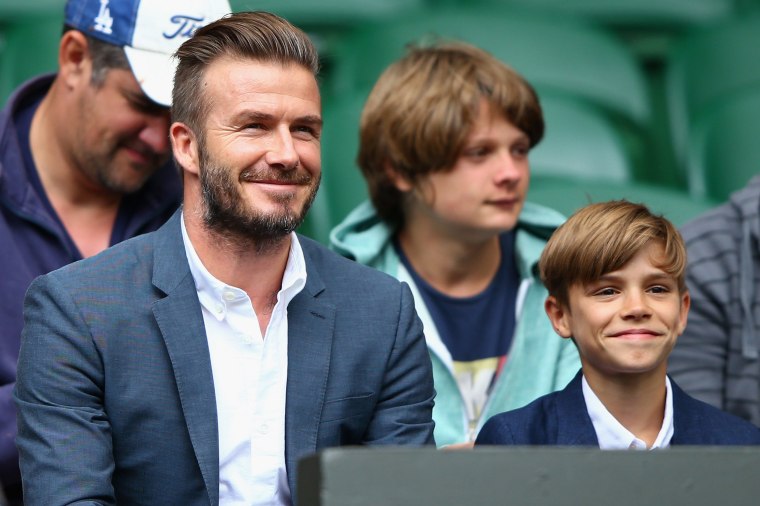 David Beckham and son Romeo Beckham attend day nine of the Wimbledon Lawn Tennis Championships at the All England Lawn Tennis and Croquet Club on July 8, 2015 in London, England.  (Ph