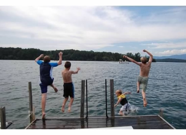 Kids jumping into a lake.