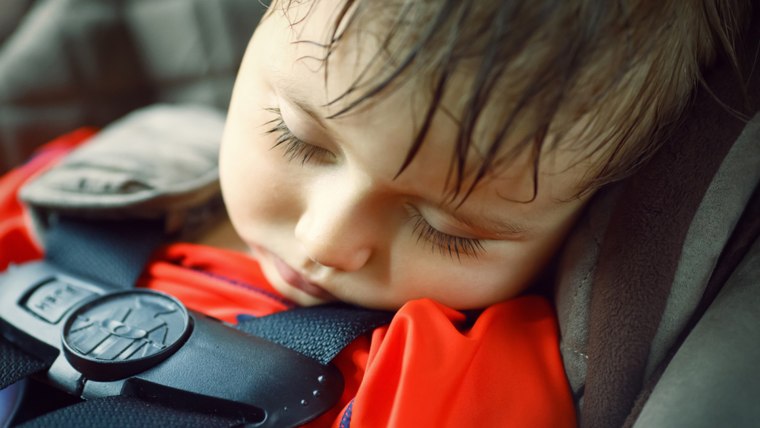 Toddler sleeping in a dangerously hot car