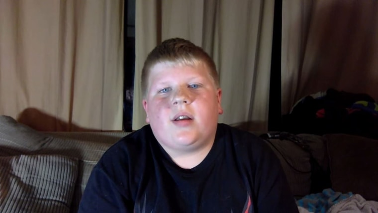 Young boy reads hateful comments about him in a YouTube video