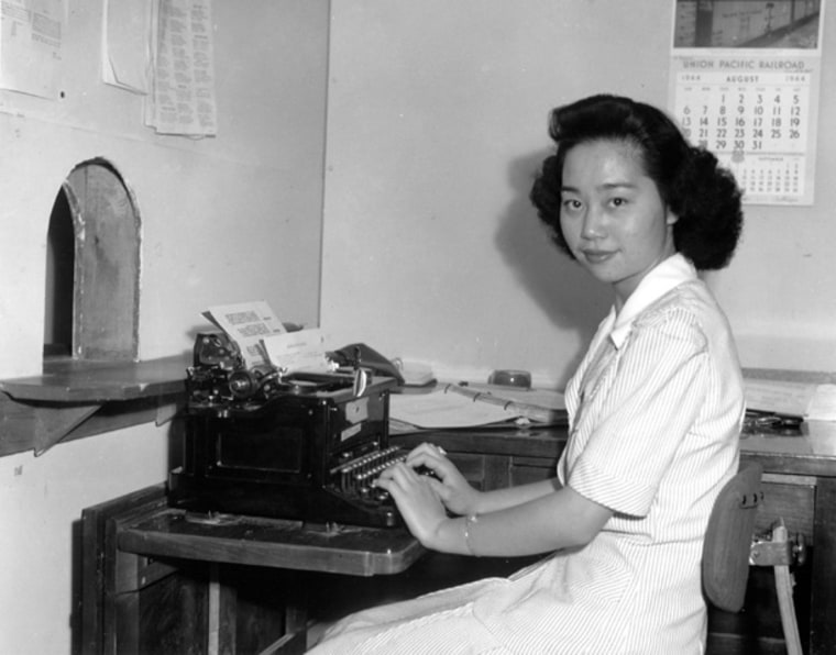 Mitsuye Endo, Supreme Court figure, seated at her desk in the administrative office at the Central Utah Relocation Center, 1942.