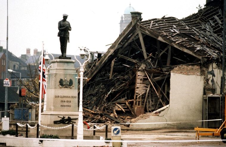 Image: The Cenotaph at Enniskillen, Northern Ireland, with the devastated community centre in the background after it was hit by an IRA bomb, is seen in this November 11, 1987 file photo.