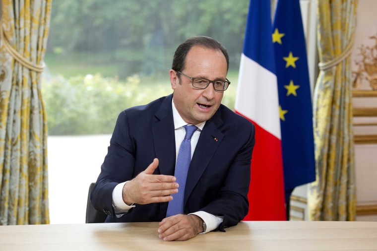 Image: French President Francois Hollande speaks during the annual television interview at the Elysee Palace following the Bastille Day military parade in Paris