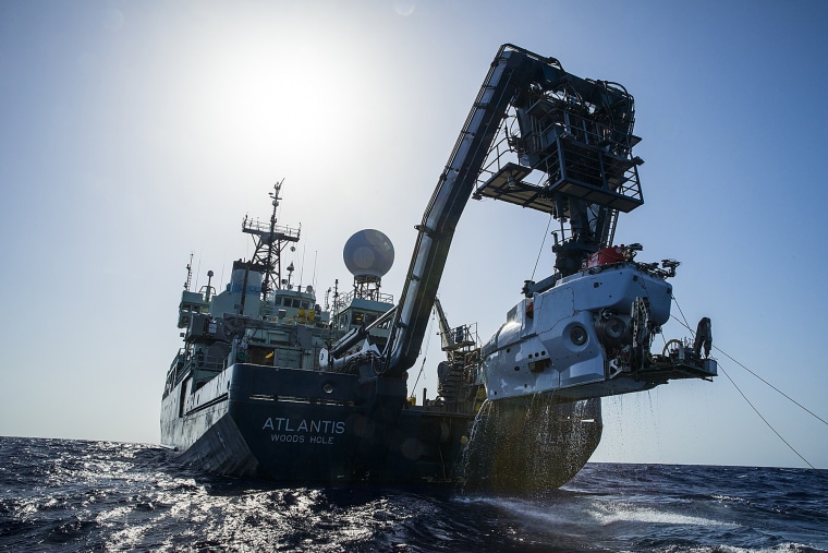 The research vessel Atlantis with the submersible Alvin hanging off its stern.