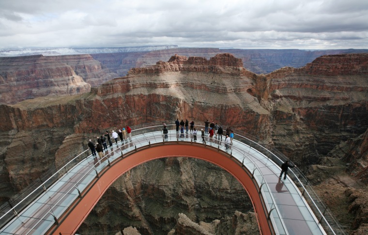 Image: A skywalk extends out over the Grand Canyon in this view from the incomplete building that houses the skywalk, on the Hualapai Indian Reservation