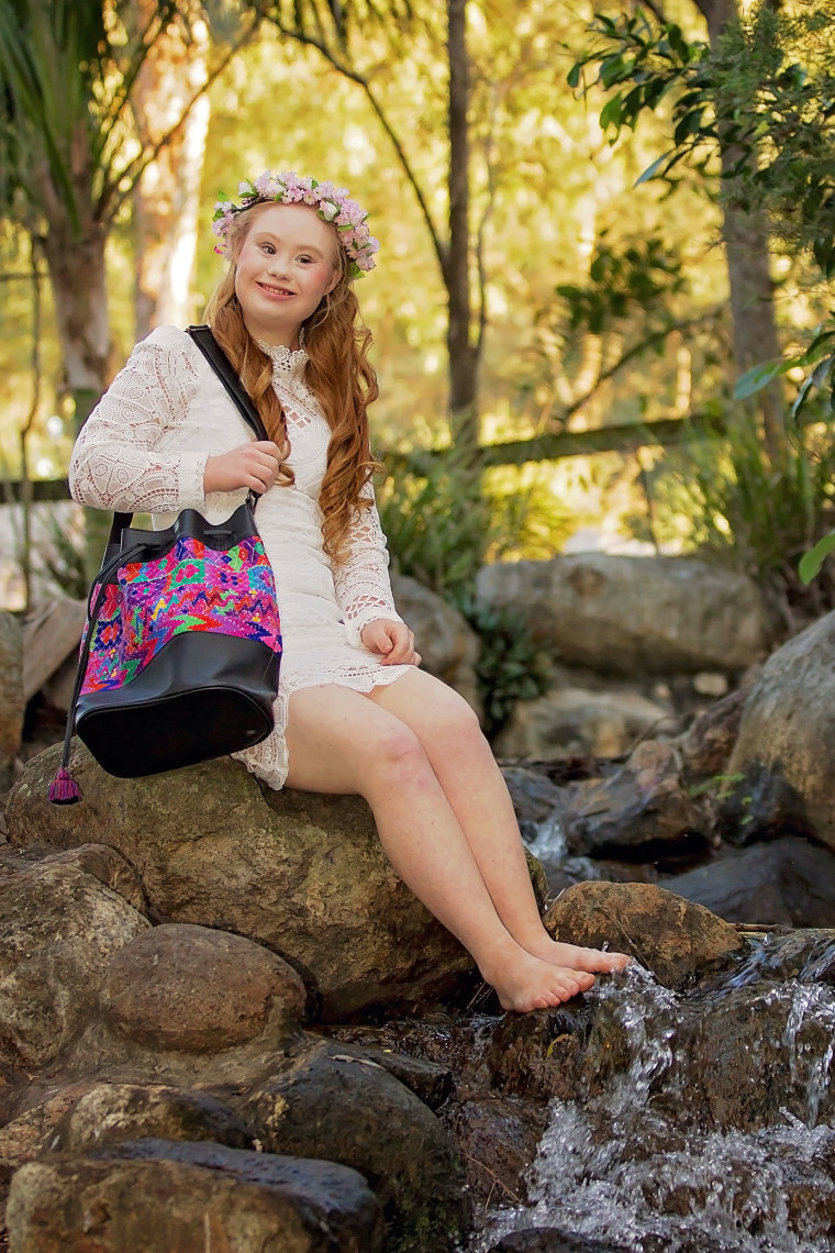 Madeline Stuart models one of everMaya's bucket bags.