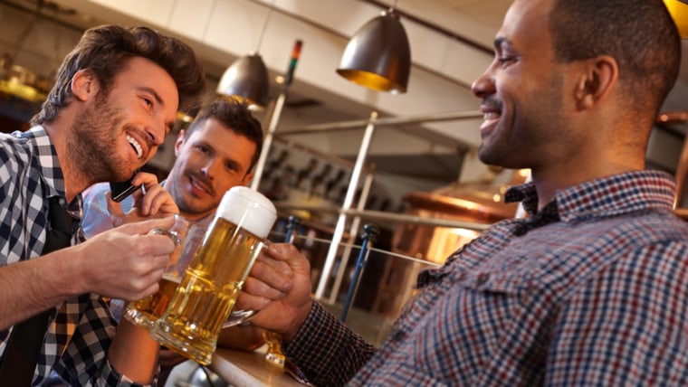 Guys in bar drinking beer
