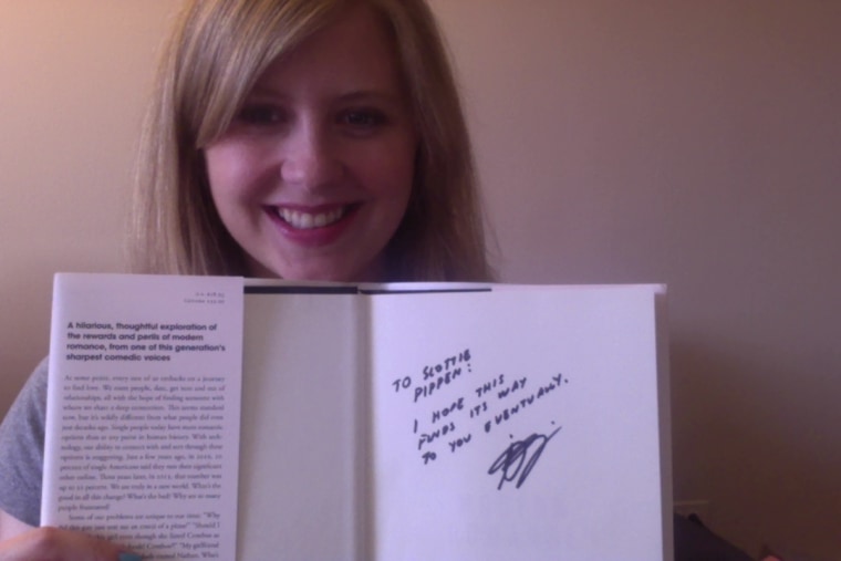 Meghan Whalen poses with a signed copy of Aziz Ansari's book "Modern Romance" at an Illinois bookstore.
