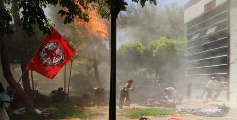 Image: The scene after an explosion in the town of Suruc