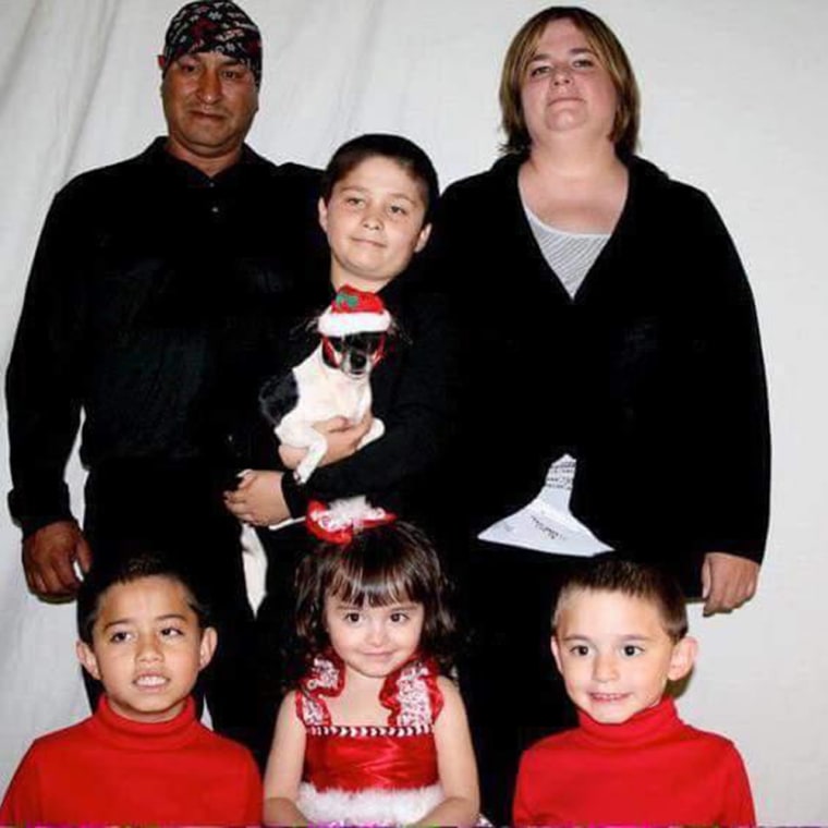 Victoria Kennard and her husband pose with their four children in this undated family photo. Kennard, who was pregnant, and two of her children lost their lives when they were swept into a river in Ripley, Ohio. Her husband and her two oldest children survived.